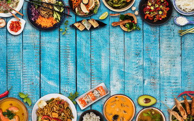 Top view composition of various Asian food in bowls