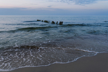 Fototapeta premium twilight, beautiful azure waves on the coast