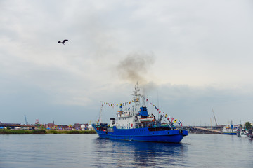 Transport vessels depart from the port to the open Baltic Sea