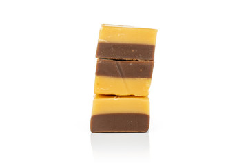 Group of three whole sweet brown caramel chocolate candy isolated on white background