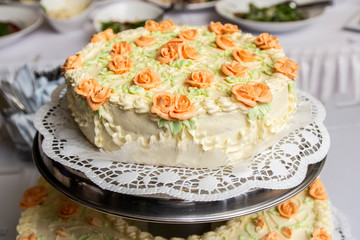 Obraz na płótnie Canvas a fancy wedding cake decorated with flowers