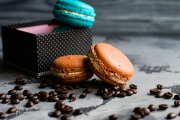 Colorful macaroons. Sweet macarons on retro dark background with copy space. Top view, Holiday time concept
