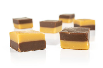Group of six whole sweet brown caramel chocolate candy isolated on white background