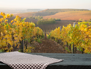 Landscape of Tuscany with desk of yellow wood