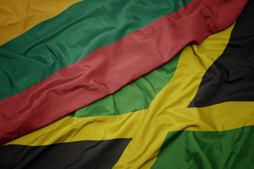 Obraz premium waving colorful flag of jamaica and national flag of lithuania.