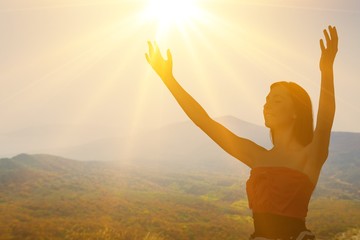 Silhouette of young woman in sunset