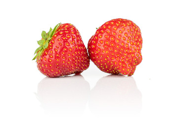 Group of two whole fresh red strawberry isolated on white background