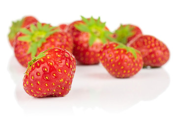Lot of whole fresh red strawberry isolated on white background