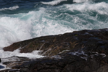 waves crashing on rocks