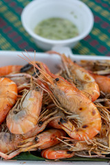 Grilled shrimp in a foam box With seafood sauce