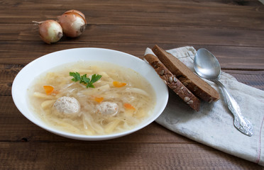 cabbage soup with meatballs brown bread and onions