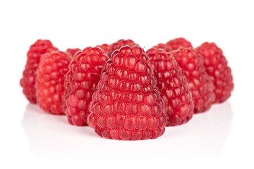 Lot of whole fresh red raspberry isolated on white background