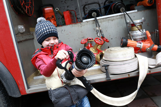 Child with fire hose