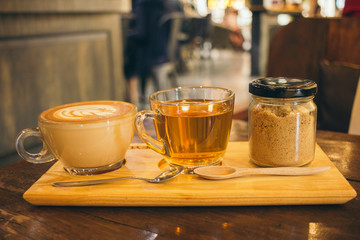 Coffee Latte art cup top view on old wooden on the wooden background