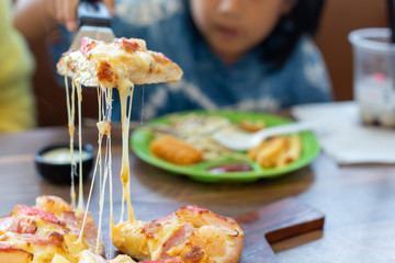 Seafood Italian Pizza slice on wood dish