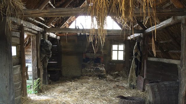 inside in old wooden house, abandoned wooden structures covered with straw,  Old rural country wooden house in village