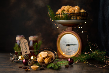 Christmas dessert cookies nuts with boiled condensed milk on a dark background with garlands and Christmas decorations.