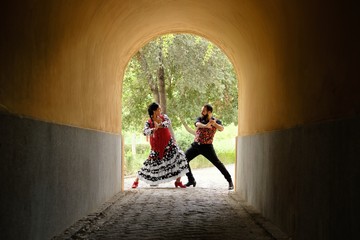 Man And Woman Dancing Flamenco In Traditional Clothes