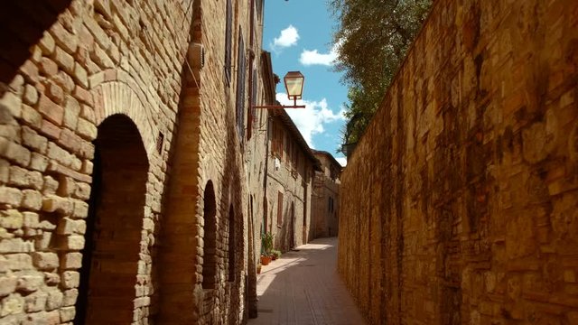 Walking along the old town of San Gimignano, Tuscany, Italy, a UNESCO World Heritage Site