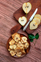 Cinnamon pear chips with fresh pears . Space for text.  Healthy snack. Homemade pear chips. Organic...