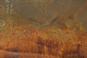 Еexture of rusty iron, cracked paint on an old metallic surface, sheet of rusty metal with cracked and flaky paint, abstract rusty metal texture. Horizontal