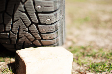 replacement of winter tires on the grass