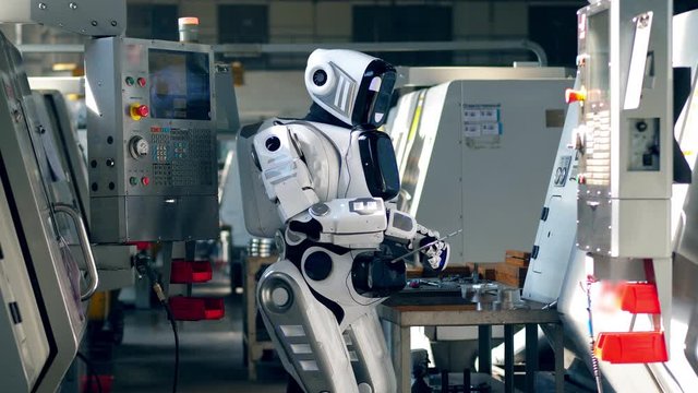 White android types on a tablet, working in a facility.