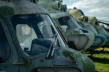 Group of rusty vintage old helicopters in military museum