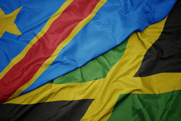 waving colorful flag of jamaica and national flag of democratic republic of the congo.