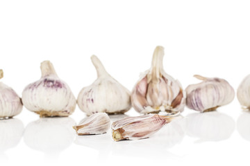Group of six whole two pieces of aromatic white garlic isolated on white background