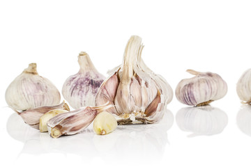 Group of five whole four pieces of aromatic white garlic isolated on white background