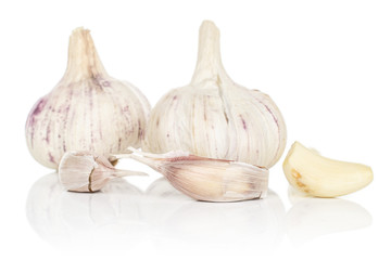 Group of two whole three pieces of aromatic white garlic isolated on white background
