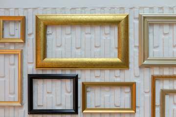 Obraz na płótnie Canvas wooden frames, hanging on the wall, mock up