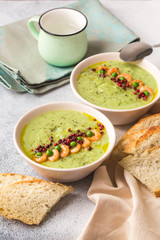 Green peas soup with shrimps, pink pepper
