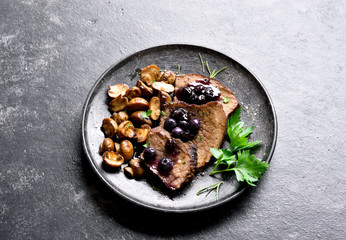 Slow cooked beef with mushrooms and blueberry sauce