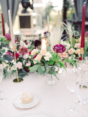 Table settings for a luxury wedding reception. Outdoor wedding
