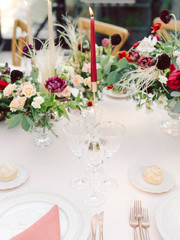 Table settings for a luxury wedding reception. Outdoor wedding