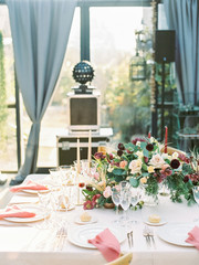 Table settings for a luxury wedding reception. Outdoor wedding