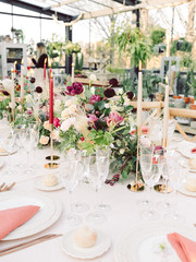 Table settings for a luxury wedding reception. Outdoor wedding