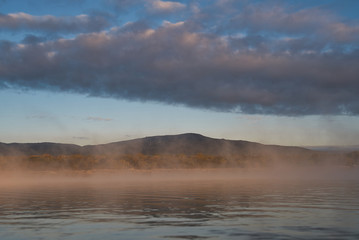 mountain over misty waters