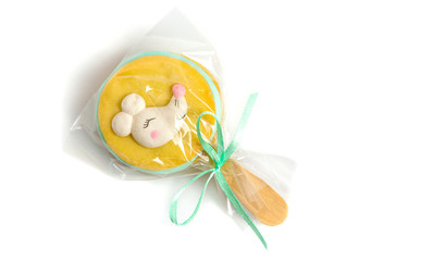 A symbolic sandwich cookie with cream on a stick with an image of a mouse, rat. Symbol of the new year 2020. Dessert, treat, gift.