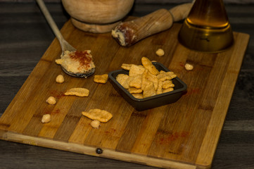 Photography of some chickpea chips with olive oil and paprika.