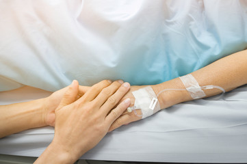 Holding hands Asian senior or elderly old lady woman patient with love, care, encourage and empathy at nursing hospital ward : healthy strong medical concept