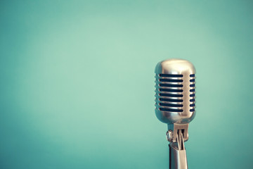 Fototapeta na wymiar retro microphone, light blue background