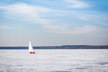Naklejka premium Sailboat on a frozen lake. Ice iceboating competition. Winter sport.