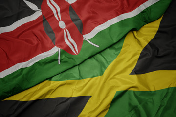 waving colorful flag of jamaica and national flag of kenya.