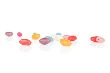 Fototapeta na wymiar Lot of whole jelly bean candy isolated on white background