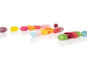 Lot of whole bright jelly bean candy isolated on white background