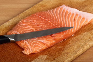 Cooking Salmon. Cutting.