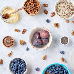 Healthy breakfast of superfoods, quinoa, honey, nuts, figs, coffee. Top view